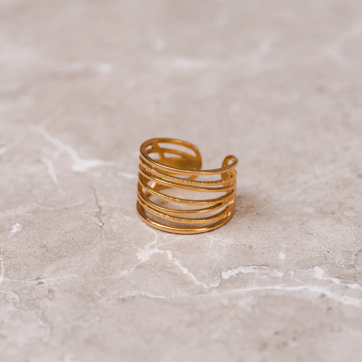 Anillo trenzado ajustable bañado en oro de 18 quilates